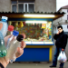 Pentru a crea o imagine sugestivă și captivantă care să reflecte esența titlului "Batjocură. În loc de caramele, un român a primit rest 5 peturi goale," iată cum ar putea arăta această compoziție: 1. **Fundal**: Alege o imagine de fundal care să sugereze un scenariu urban sau un mic magazin de cartier. Poate include un colț al unei piețe sau un stand de vânzare. 2. **Element central**: În centrul imaginii, plasează o mână de adult care ține cinci sticle din plastic goale (peturi), unele poate având etichete ușor uzate sau rupte pentru a sublinia aspectul lor de deșeu. 3. **Personaj secundar**: Într-un colț al imaginii, surprinde un personaj care poate fi perceput ca un vânzător, privind în altă parte sau manifestând indiferență. Acest detaliu subliniază aspectul de "batjocură". 4. **Contrast**: Utilizează culori contrastante pentru a evidenția peturile din plastic față de fundal, astfel încât să fie clar mesajul central. 5. **Text sugestiv**: În partea de sus sau jos a imaginii, include textul cu titlul articolului, folosit într-un font îndrăzneț și clar, pentru a asigura înțelegerea mesajului. 6. **Detalii subtile**: Adaugă elemente care să sugereze ideea de cumpărare, cum ar fi o tejghea sau un ban pe fundal, pentru a pune în context situația. Această imagine ar putea transmite în mod vizual și sugestiv ideea principală a articolului și titlul său.